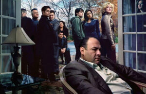 Tony Soprano assis dans un fauteuil avec tous les personnages de la série derrière lui Tony Soprano assis dans un fauteuil avec tous les personnages de la série derrière lui